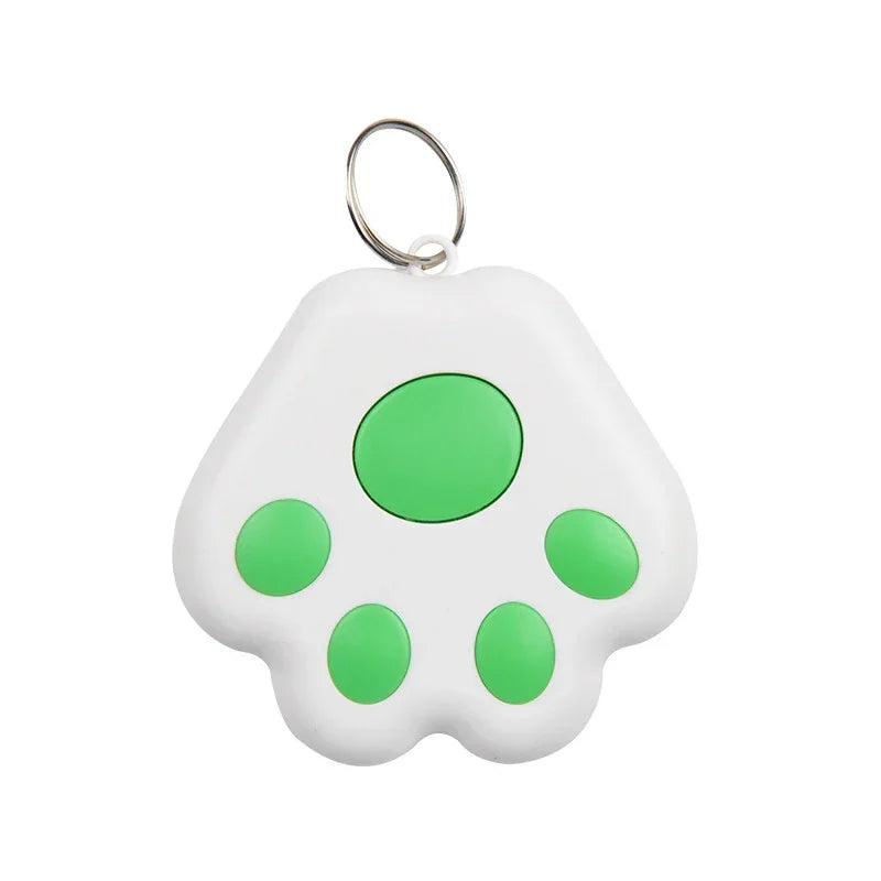 White paw-shaped keychain tracker with green spots 