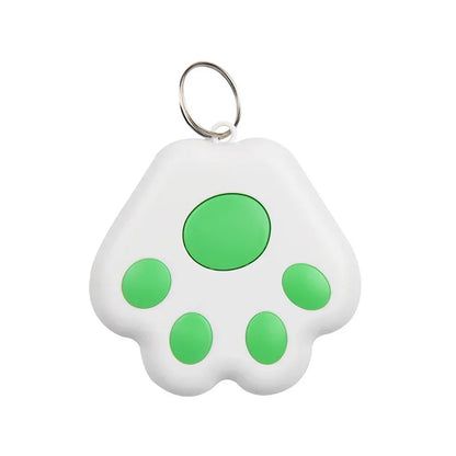 White paw-shaped keychain tracker with green spots 